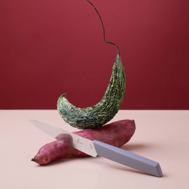 A composition of a vegetable cutting knife, a dried zucchini and a sweet potato